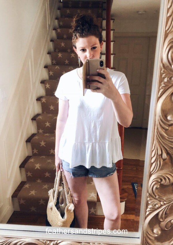 white peplum top and parrot earrings