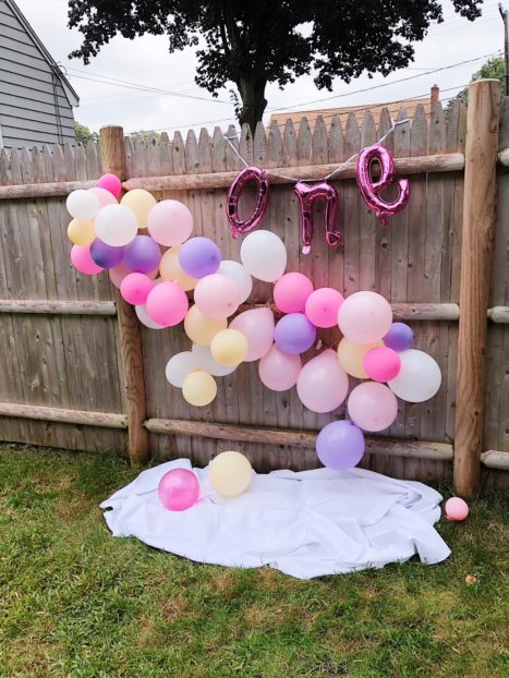 a picnic-inspired pink and purple and yellow first birthday party for baby girl