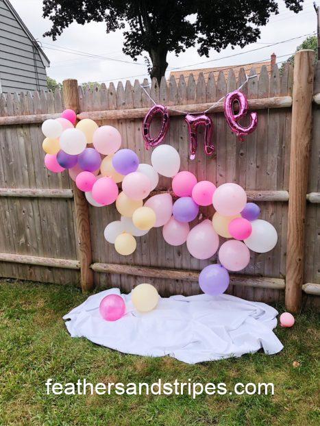 a picnic-inspired pink and purple and yellow first birthday party for baby girl