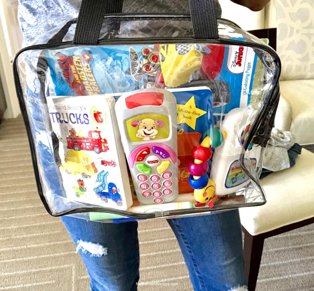activity bag for traveling with a toddler - perfect for flying with a toddler! feathersandstripes.com