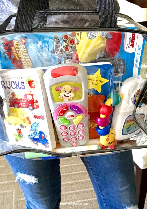 activity bag for traveling with a toddler - perfect for flying with a toddler! feathersandstripes.com