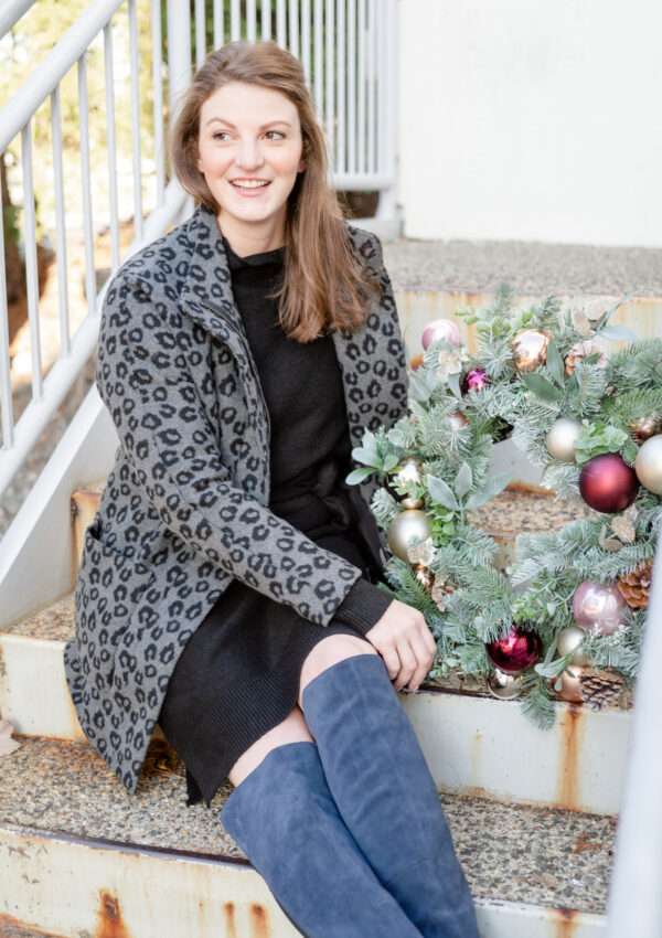How to wear a black sweater dress with OTK boots - comfy and classic for a holiday get-together