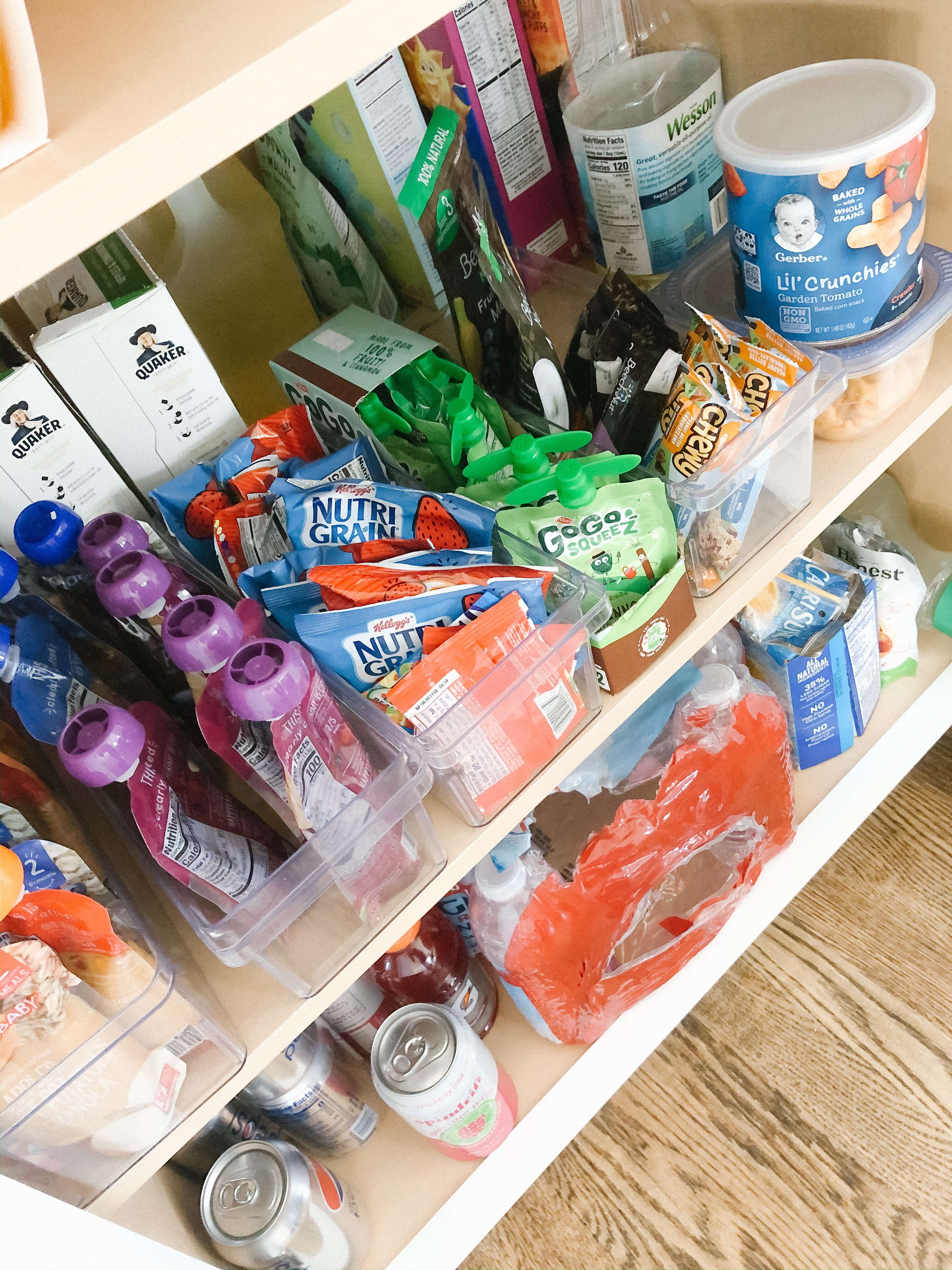 Snack cabinet all set up, with the toddler's snacks within their reach  (bottom shelf not pictured is surplus) : r/organization