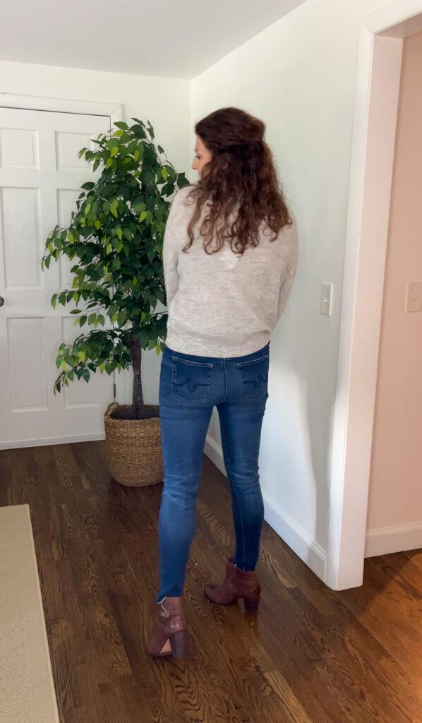 woman showing back of her sweater