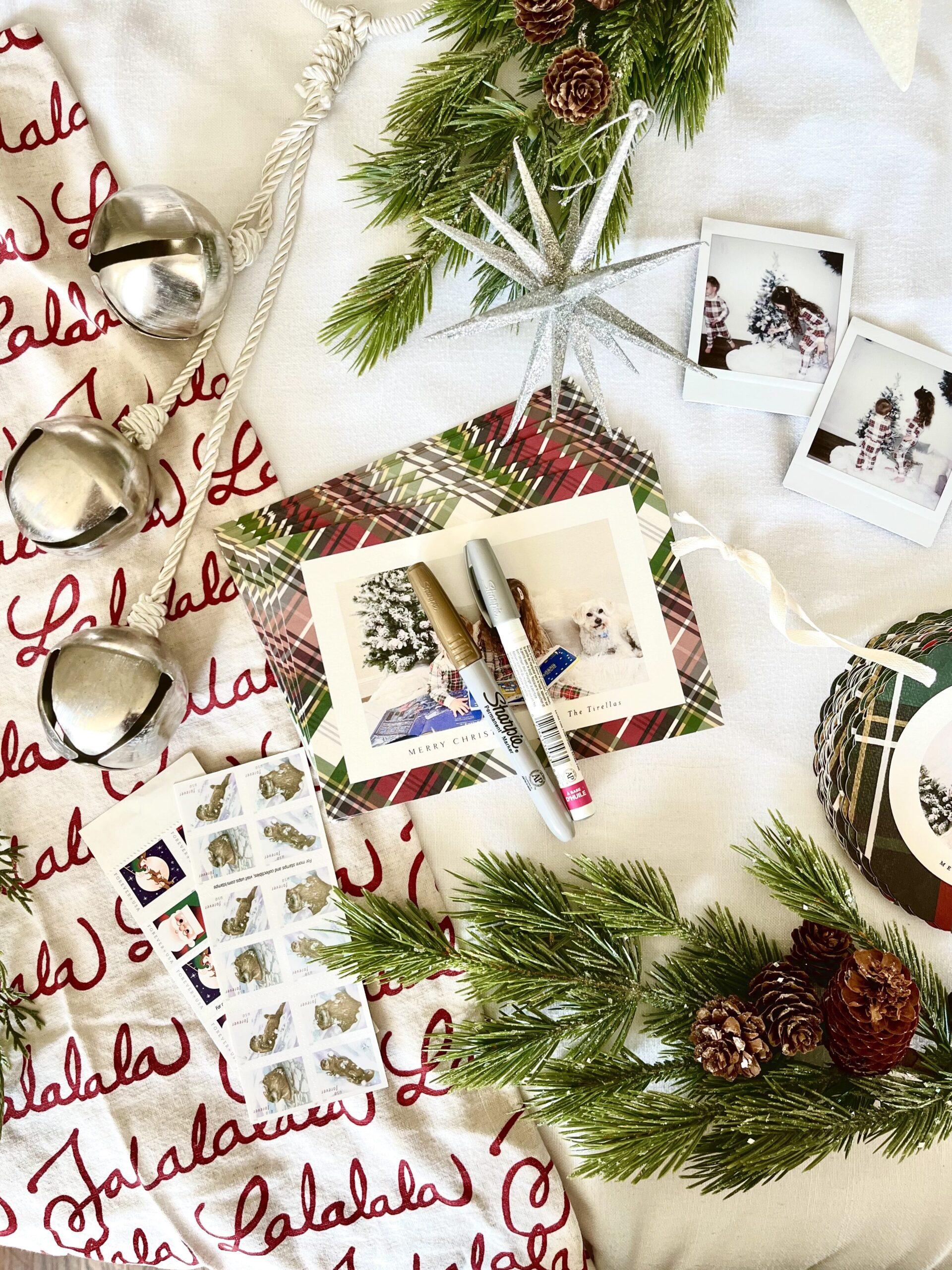 Christmas cards, photos, and pen