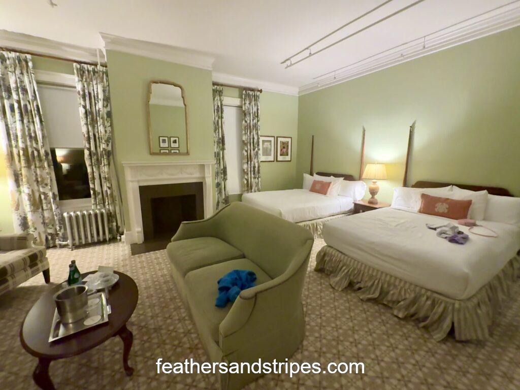 omni mount washington hotel room with 2 beds and a fireplace